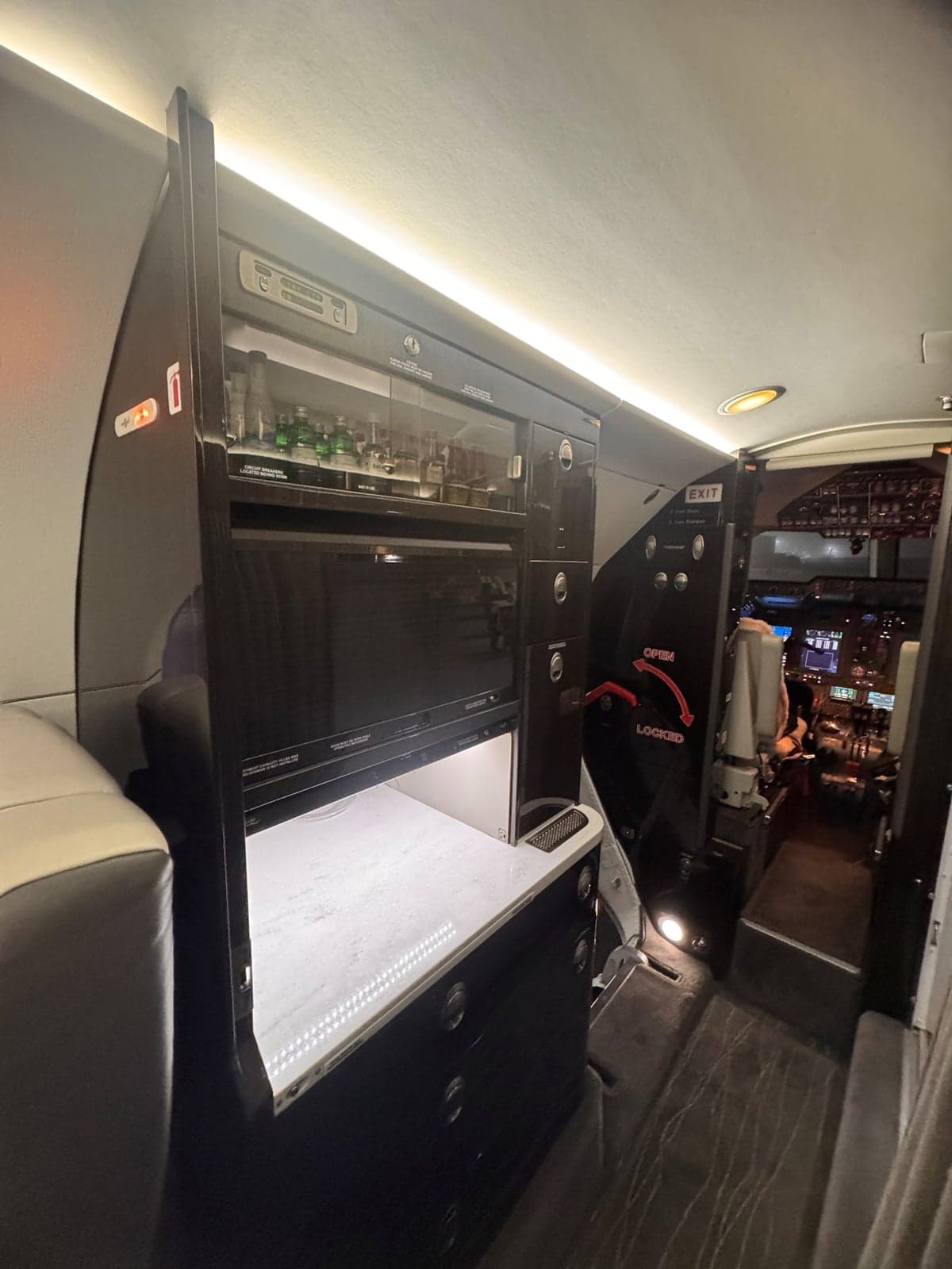 View of the aircraft's interior showing the galley and cockpit.