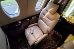 View of the cabin seats and table in a Cessna Citation CJ3+.