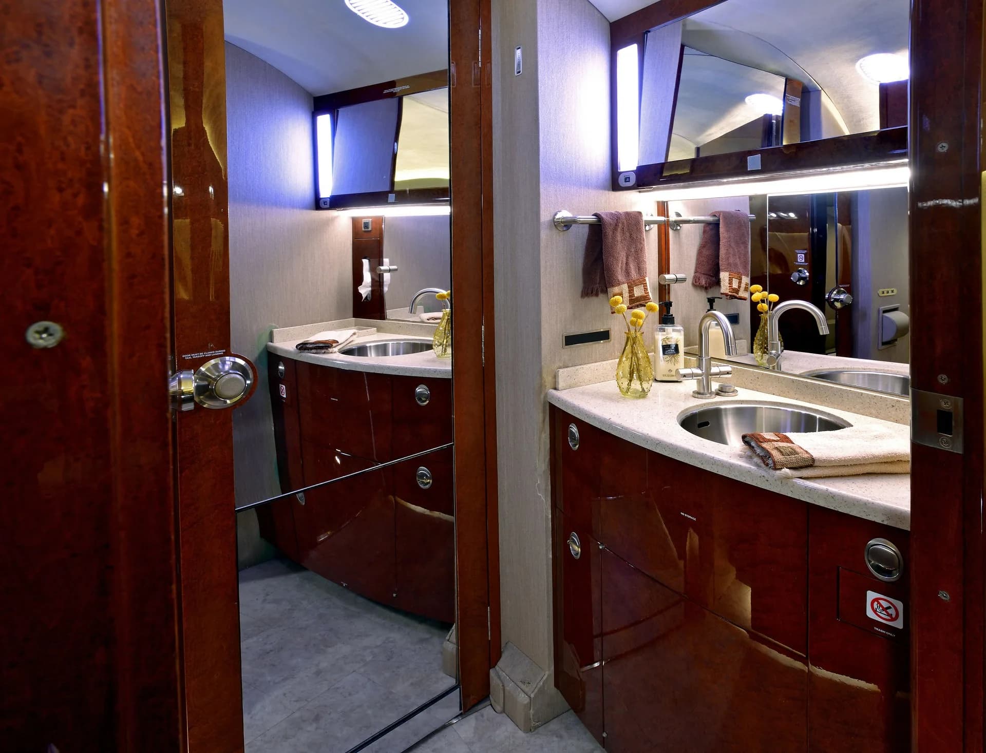 View of the aircraft's lavatory with a sink and mirror.