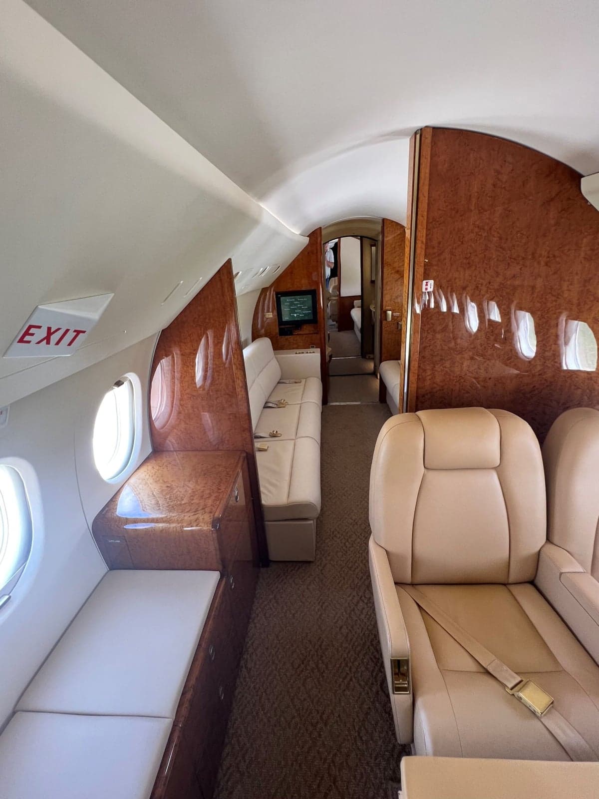 Interior of the aircraft showing two seats and a view into the cockpit.