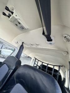 View of the interior ceiling and back seats of the aircraft.