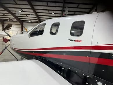 Close-up of the fuselage of a TBM 850 aircraft.