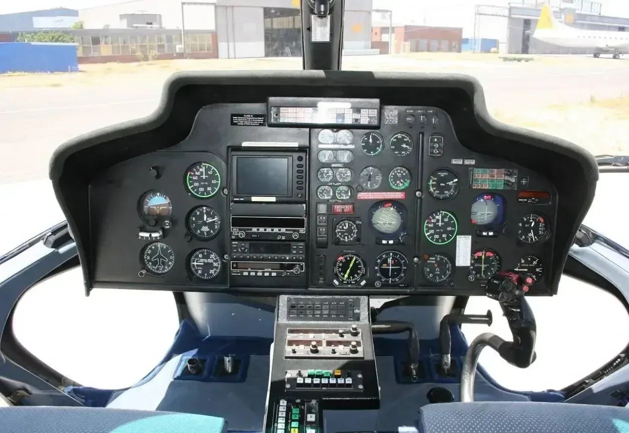 Close-up of the helicopter's instrument panel and controls.