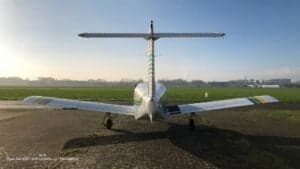 Rear view of the Piper Lance II aircraft on the tarmac.