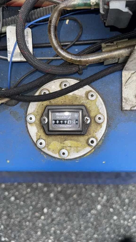 A close-up view of a Honeywell Quartz hour meter showing 0045.8 hours.