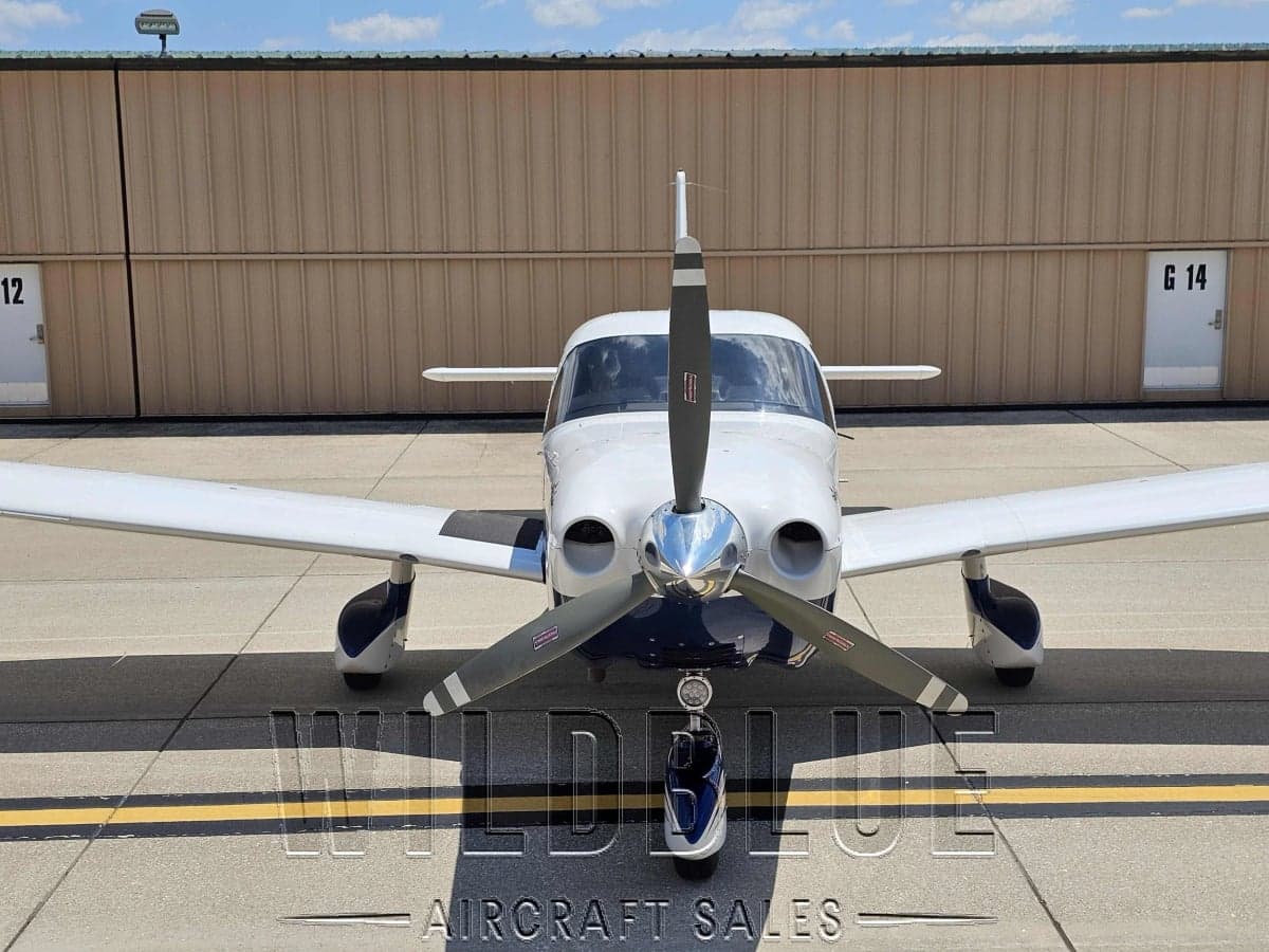 Piper PA-28R-201T Turbo Arrow III on the tarmac with Wildblue Aircraft Sales overlay.