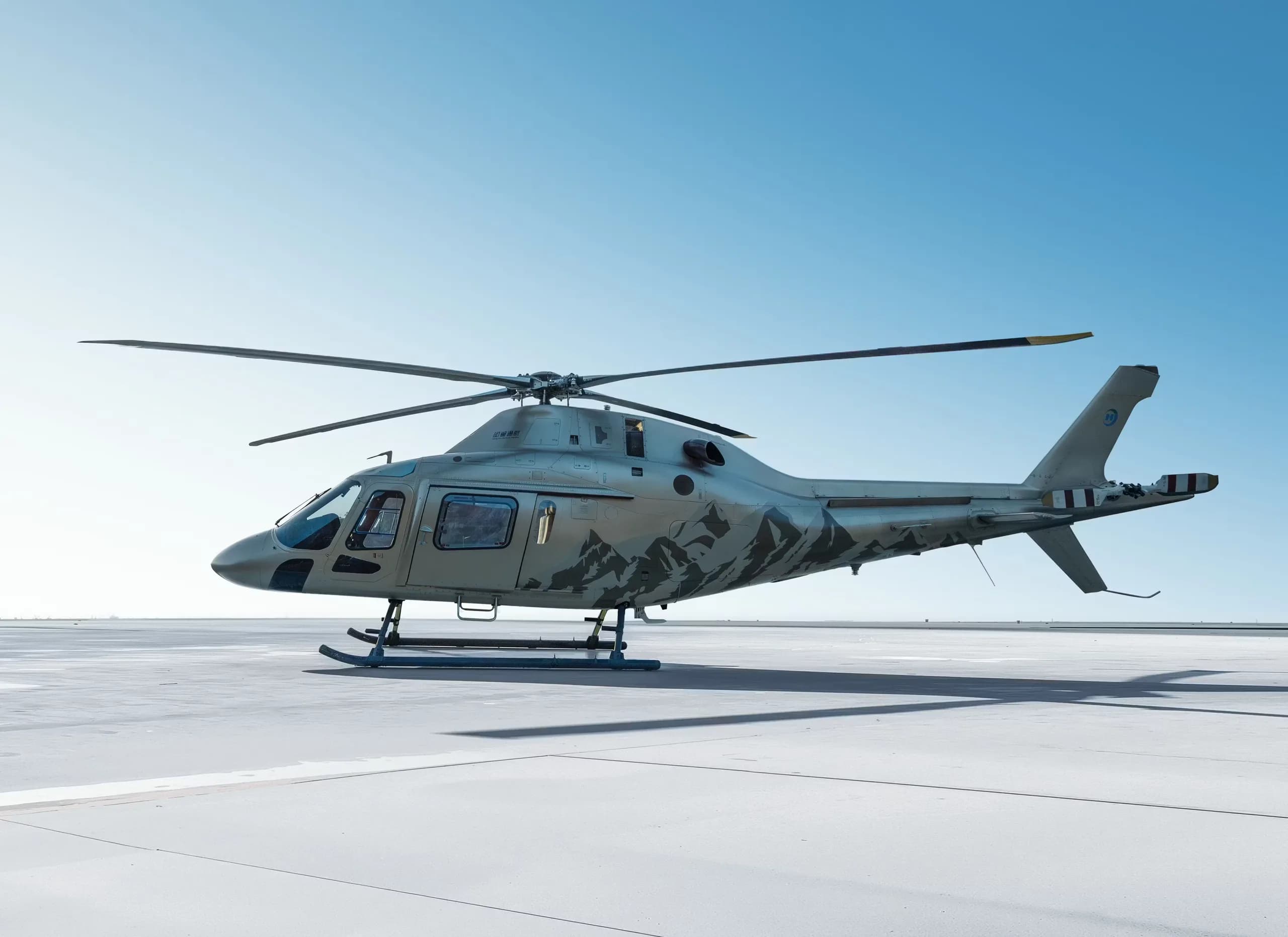 A B-704A helicopter is parked on the tarmac.