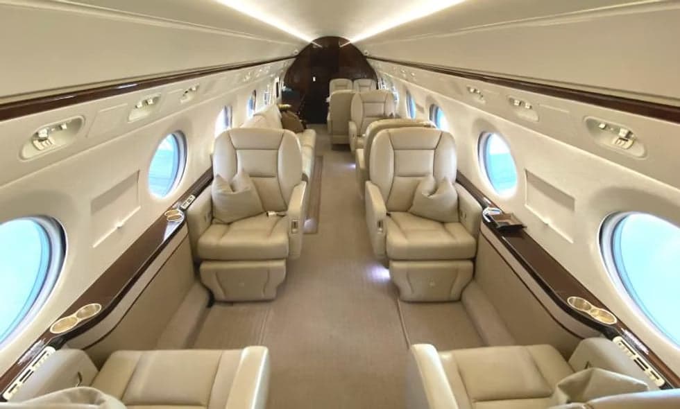 The cockpit of a jet with multiple screens and controls.