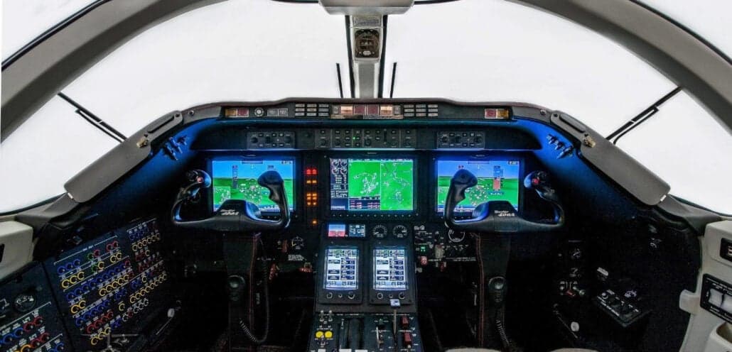 View of the aircraft cockpit with instrument panel and displays.