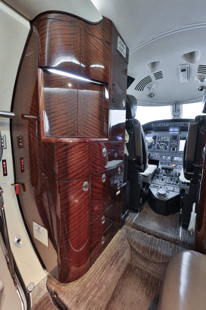 View of the Citation CJ3 interior showing the cockpit and cabinetry.