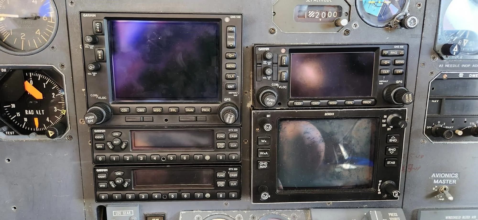 A close-up view of the Garmin avionics stack and other instruments in the cockpit.