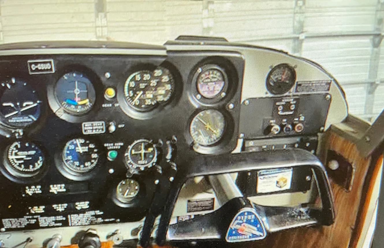 Close-up of the aircraft's instrument panel, showing various gauges and controls.