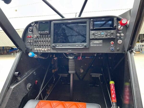 View of the aircraft cockpit with a carbon fiber panel and Garmin avionics.