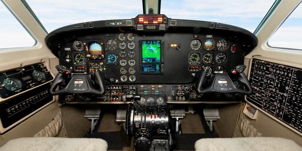 The cockpit of a Beechcraft King Air, N508SK, showing the instrument panel with analog gauges and modern displays.