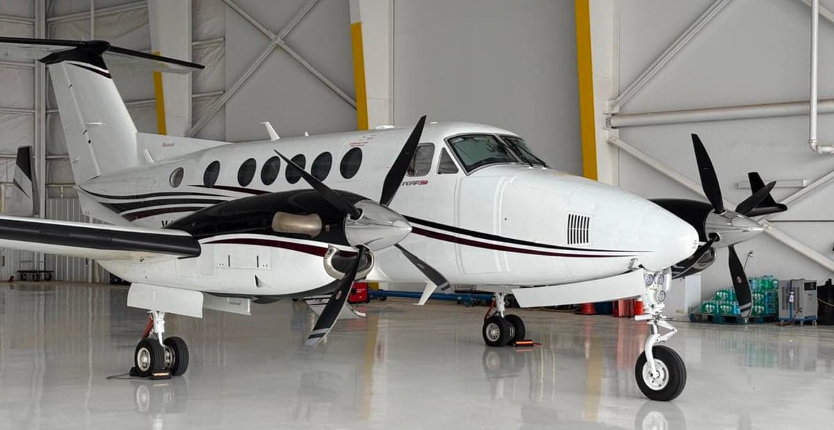 Two King Air 250 aircraft parked in a hangar.
