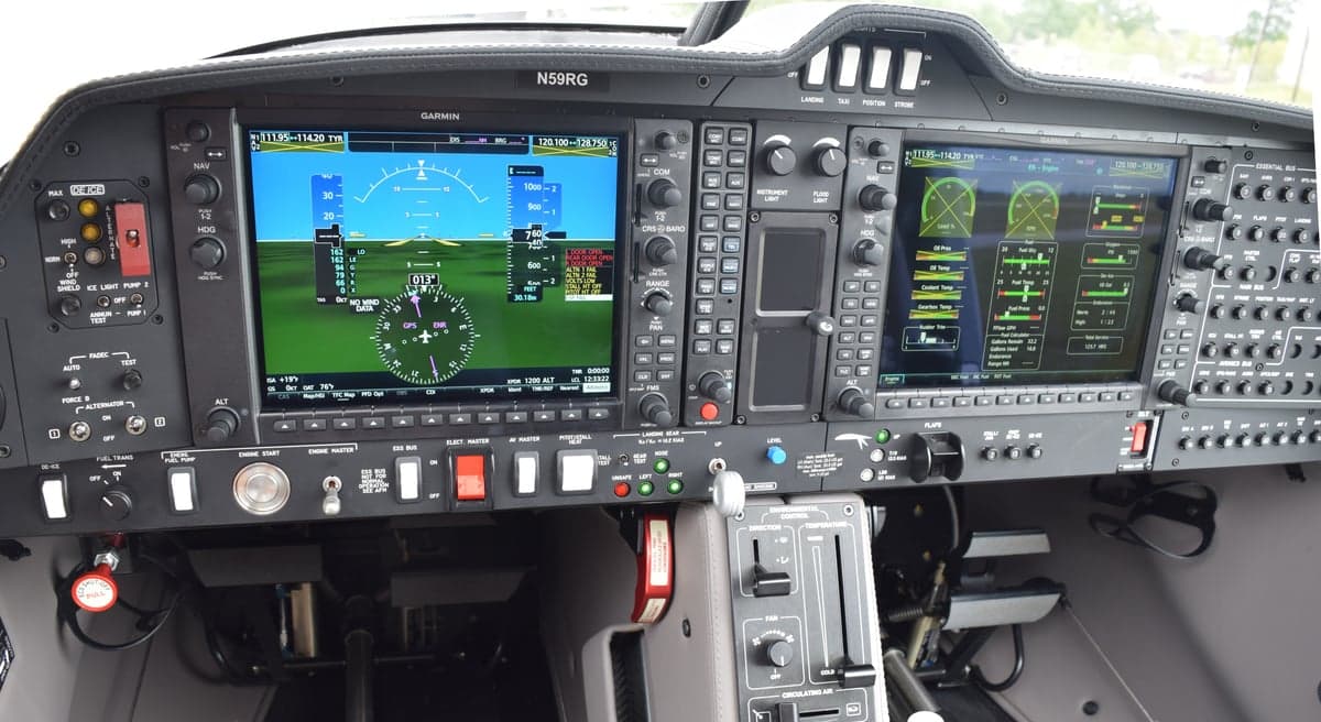 The cockpit of a Diamond DA50 RG aircraft, showing the Garmin G1000 NXi avionics suite with dual displays and various controls.