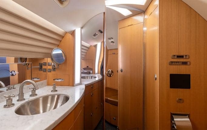 Aircraft cabin interior with couches.