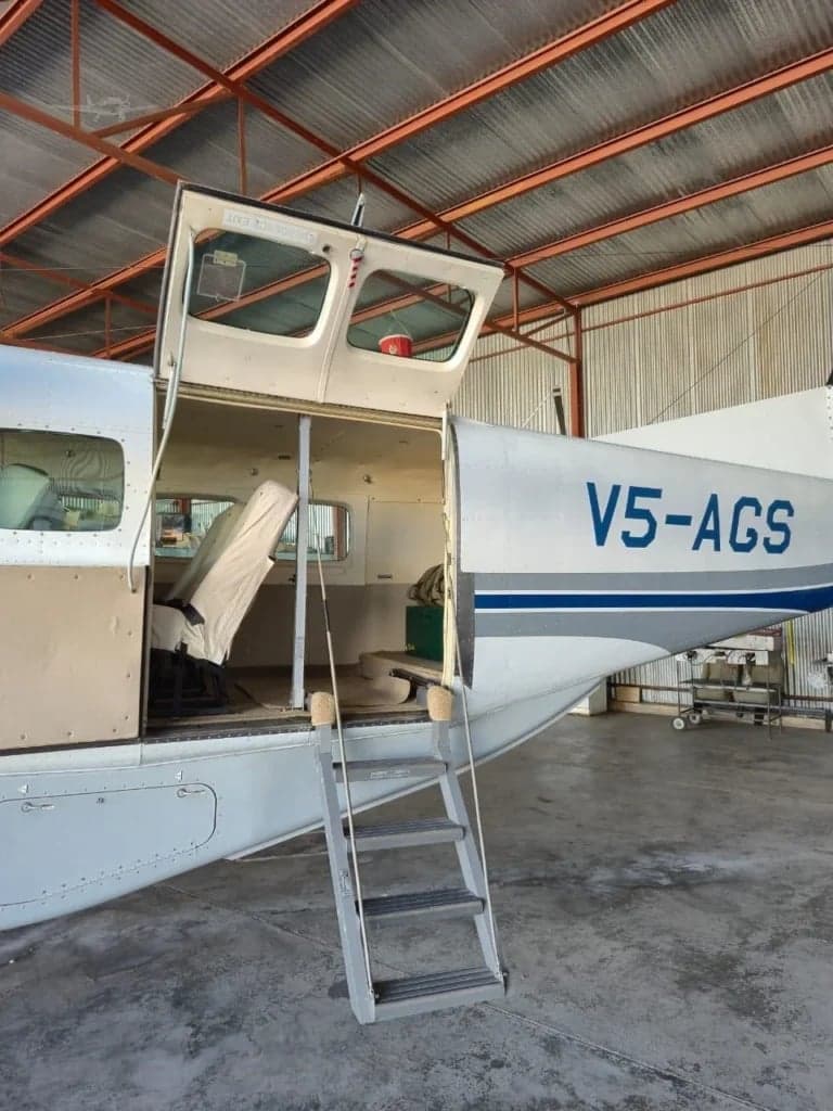 The open door and steps of the Cessna Caravan aircraft.