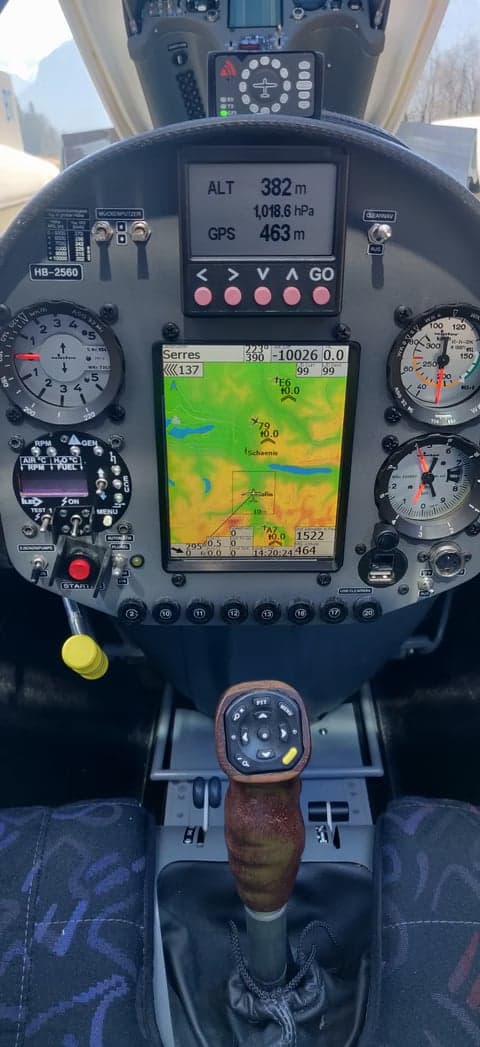 Close-up of the instrument panel in the cockpit of HB-2560 showing GPS display.
