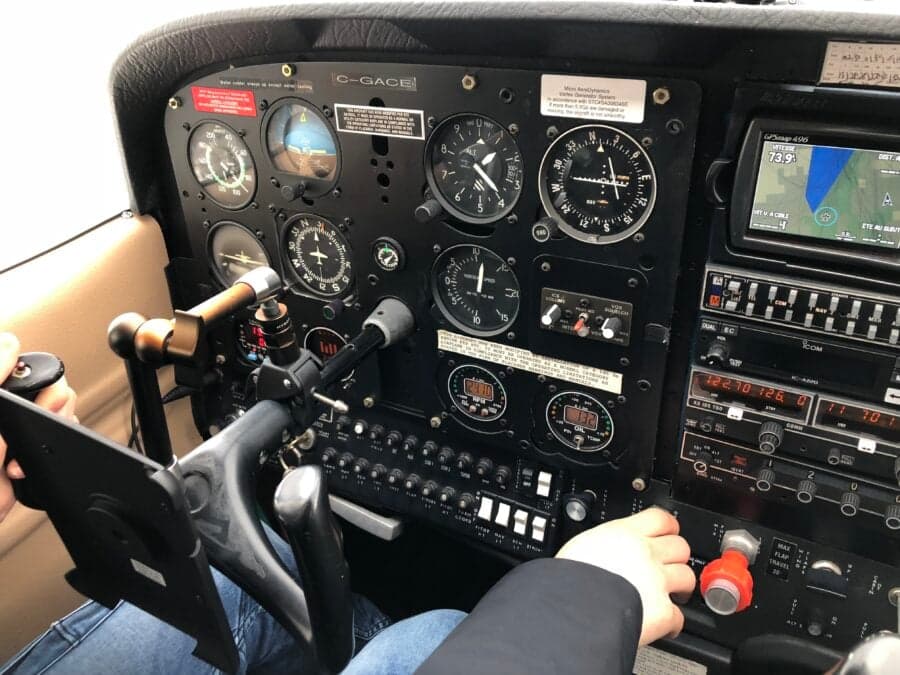 Close-up of the instrument panel in the cockpit of an aircraft.