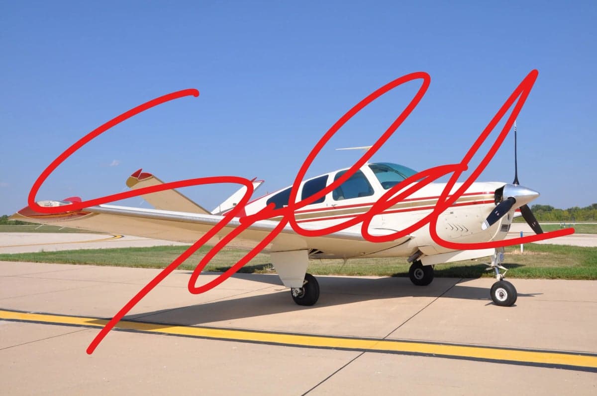 A Beechcraft Bonanza aircraft is shown on the tarmac with a red 'SOLD' overlay.