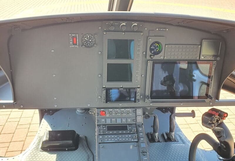 A close-up view of the instrument panel in the cockpit of a helicopter.