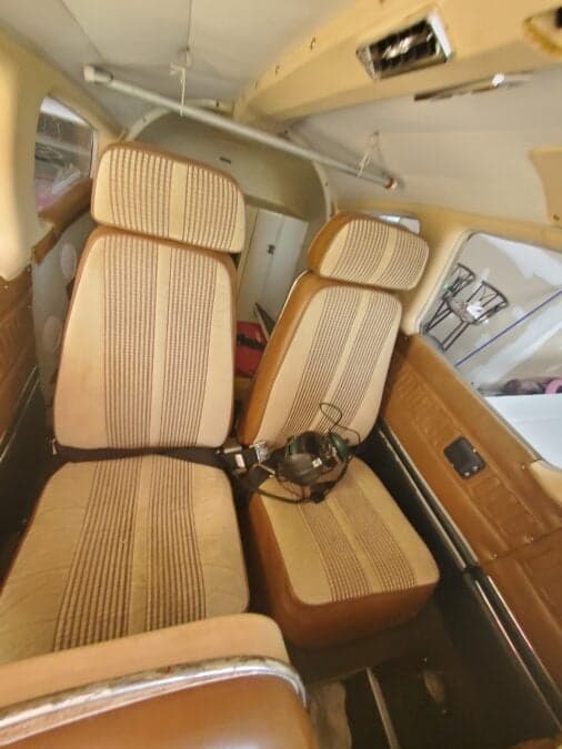 View of the aircraft's interior, showing the seats and headset.