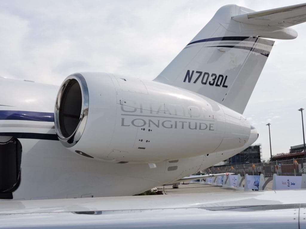 Close up of the tail and engine of a Citation Longitude jet.
