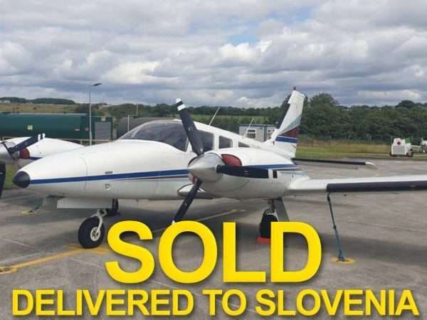 A Piper Aerostar aircraft on the tarmac with a SOLD overlay.