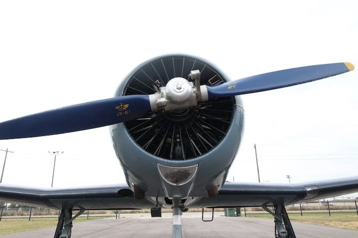Front view of the N700YK aircraft, showing the propeller and engine.