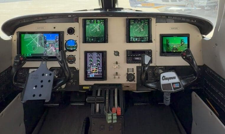 The cockpit of a twin-engine aircraft featuring modern avionics.