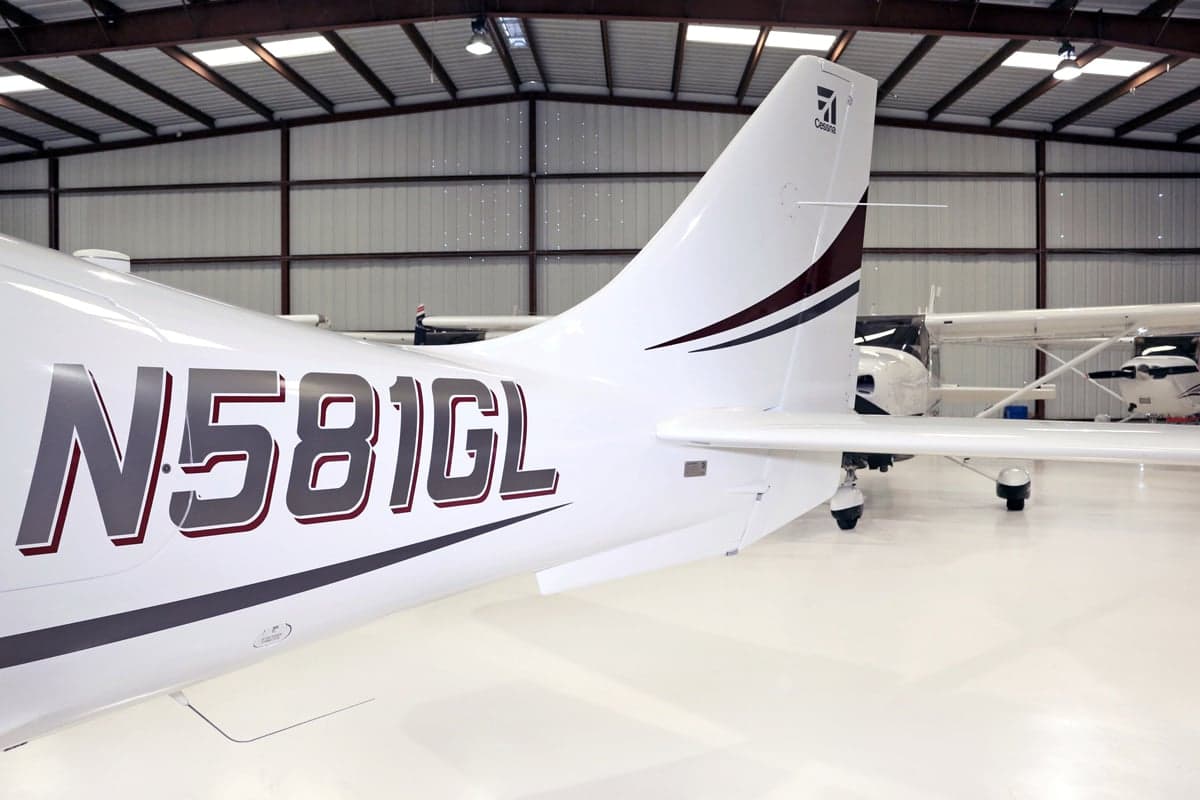 Tail section of a Cirrus aircraft with registration number N581GL.