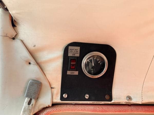 Close-up of the fuel gauge and switch in the Cessna 210 cockpit.