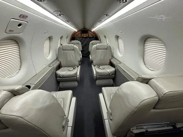 Interior view of the aircraft cabin with leather seats.