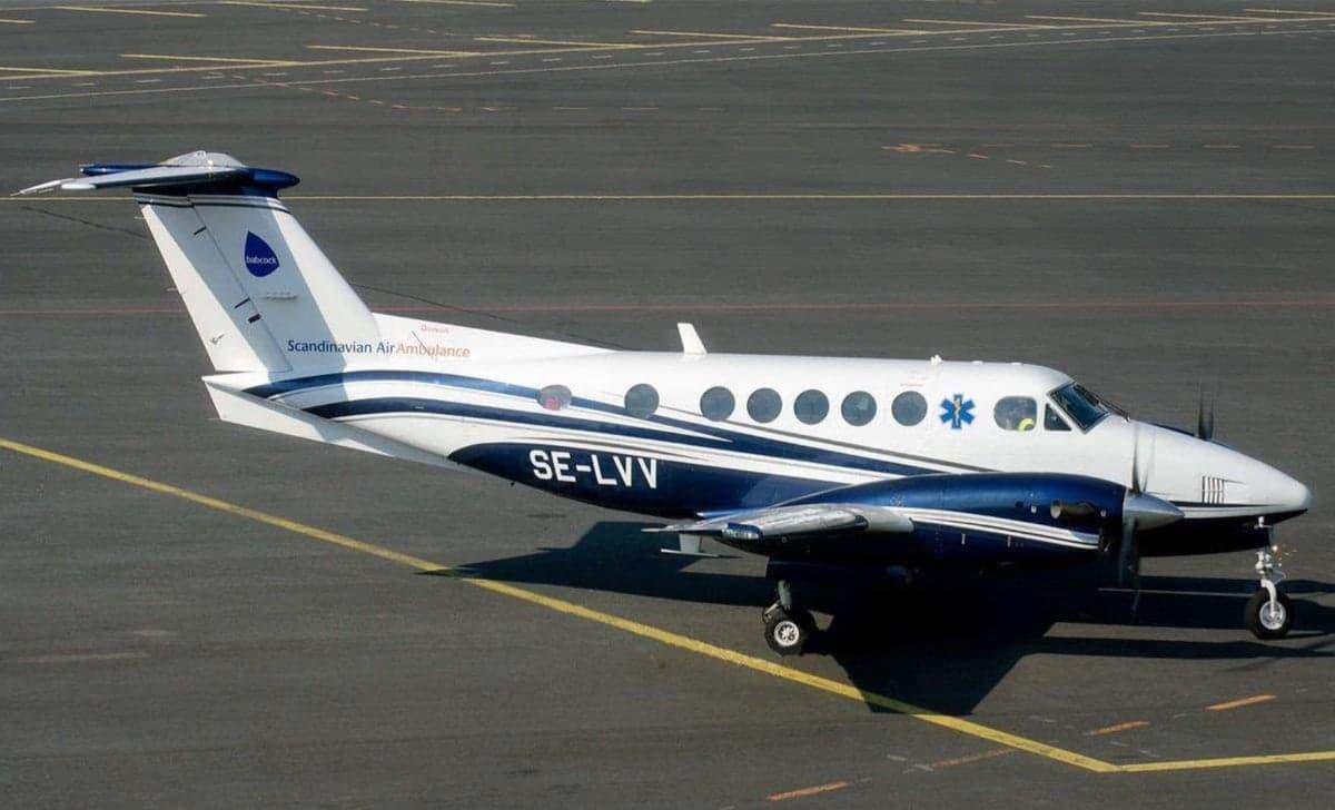 King Air aircraft on the ground with Scandinavian Air Ambulance livery.