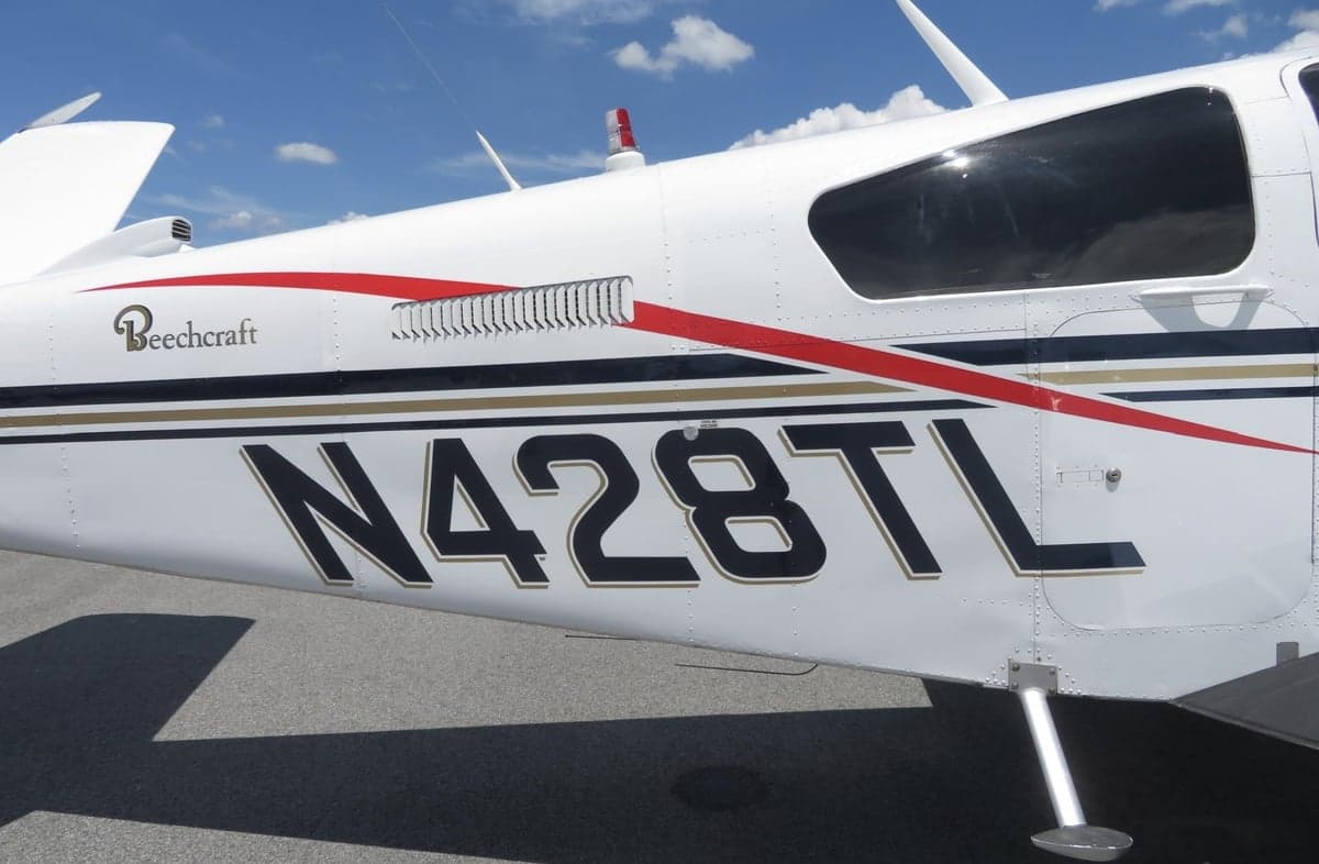 Close-up of the Beechcraft Bonanza N428TL registration and paint scheme.