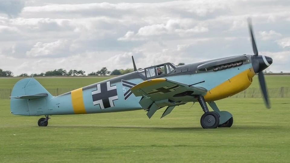Messerschmitt Bf 109 aircraft parked on a runway.