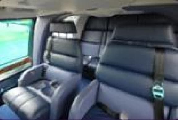 Close-up of the helicopter cabin seats with black leather.