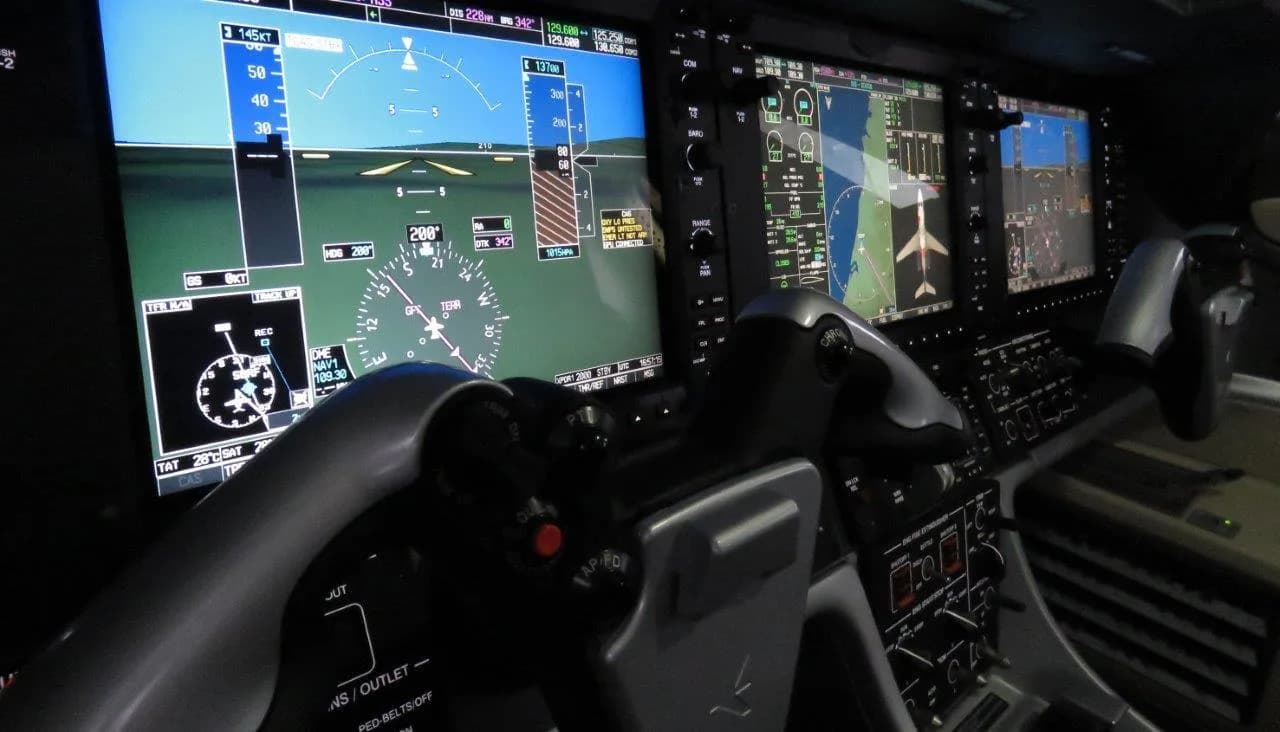 The Phenom 300E cockpit features advanced avionics and displays.