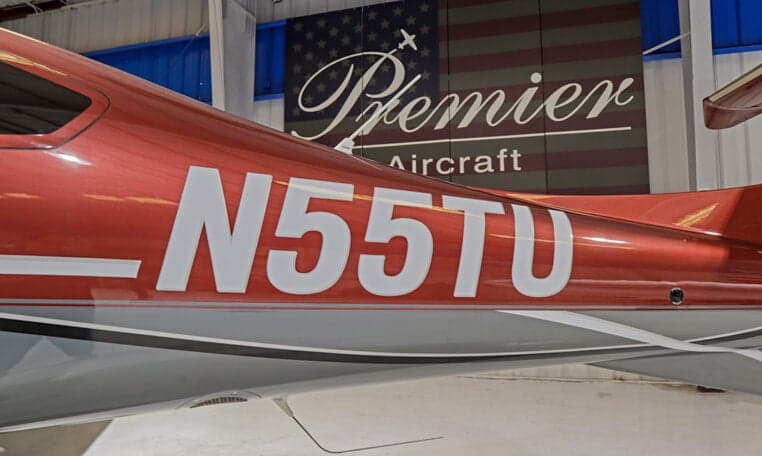 Close up of the tail of a Diamond DA62 aircraft showing the registration N55TU.