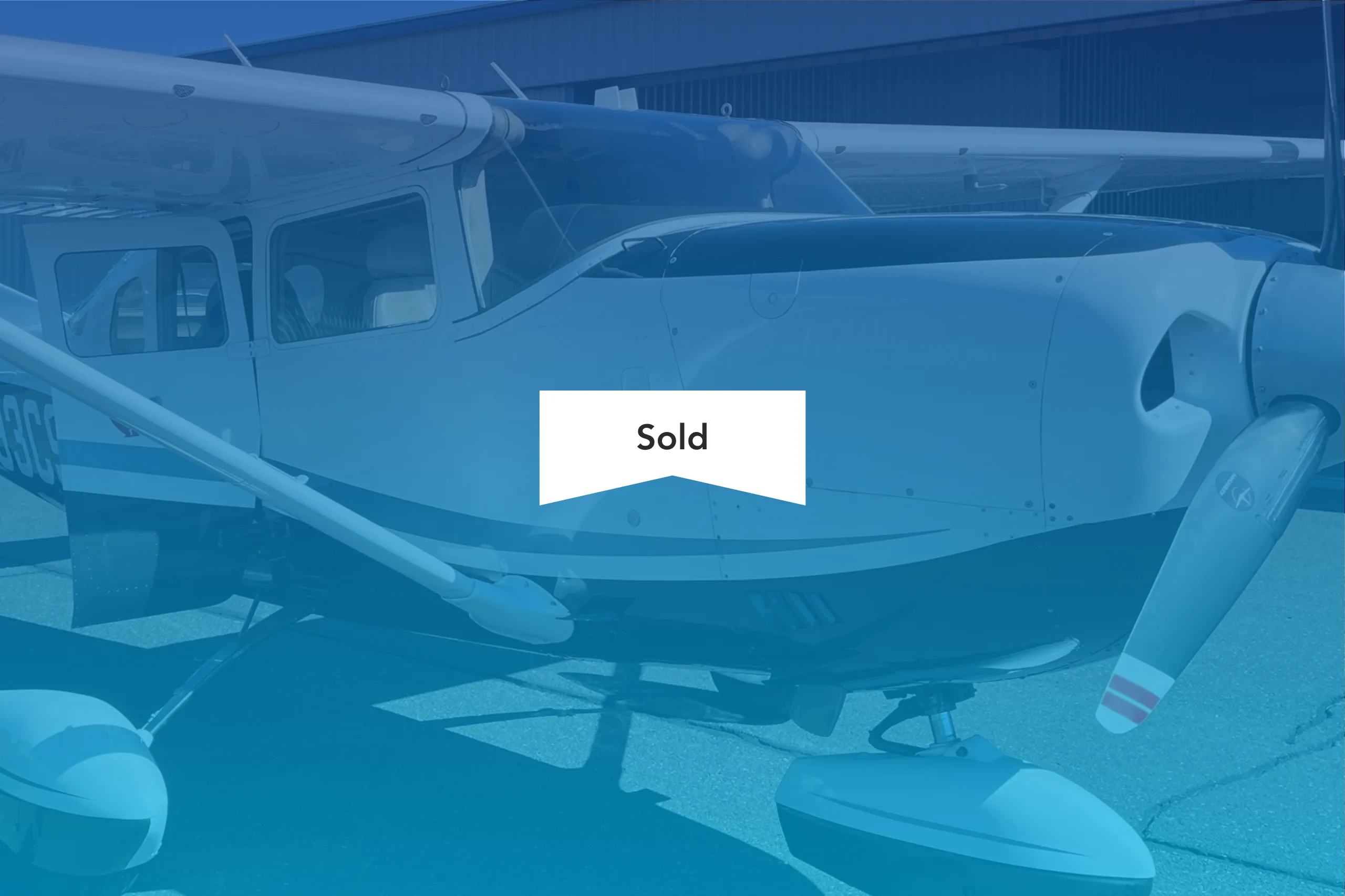 Close up of the Cessna Stationair with a SOLD banner overlayed.