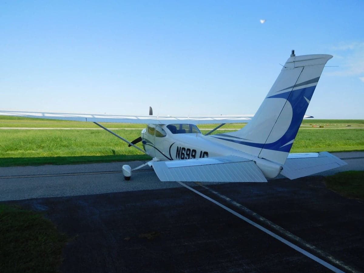 Rear view of the N699JG Cessna aircraft on the tarmac.