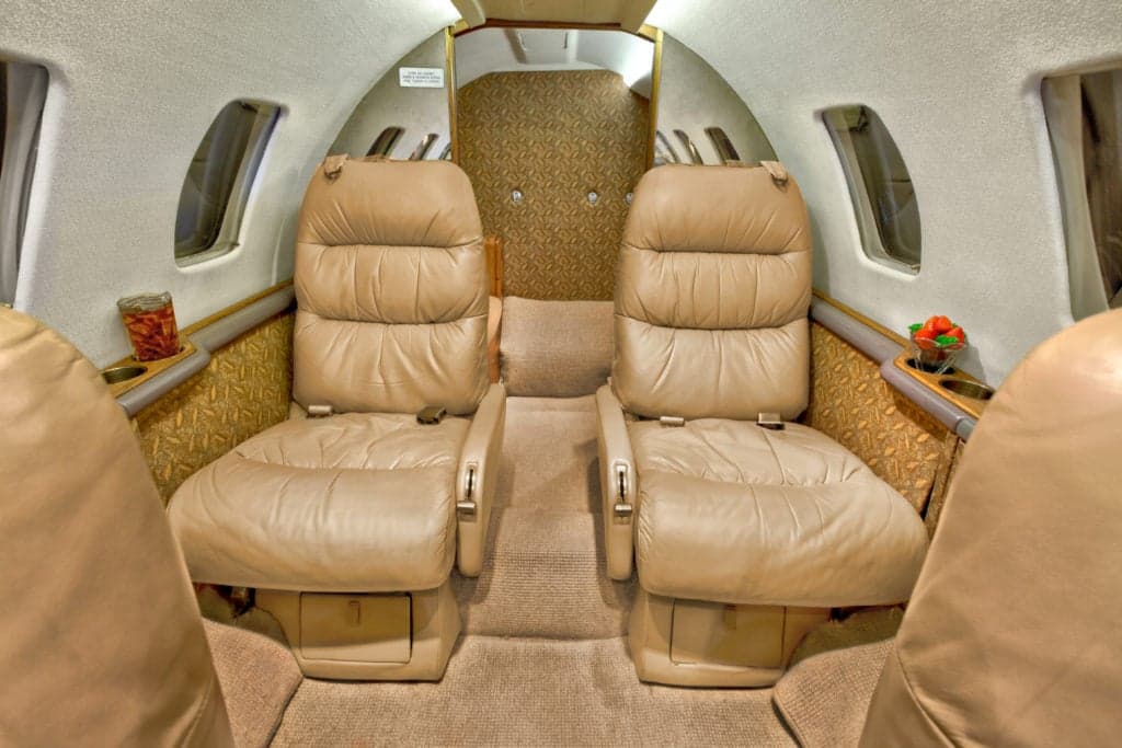 Close-up of the Citation Ultra cabin seating area with plush leather seats.