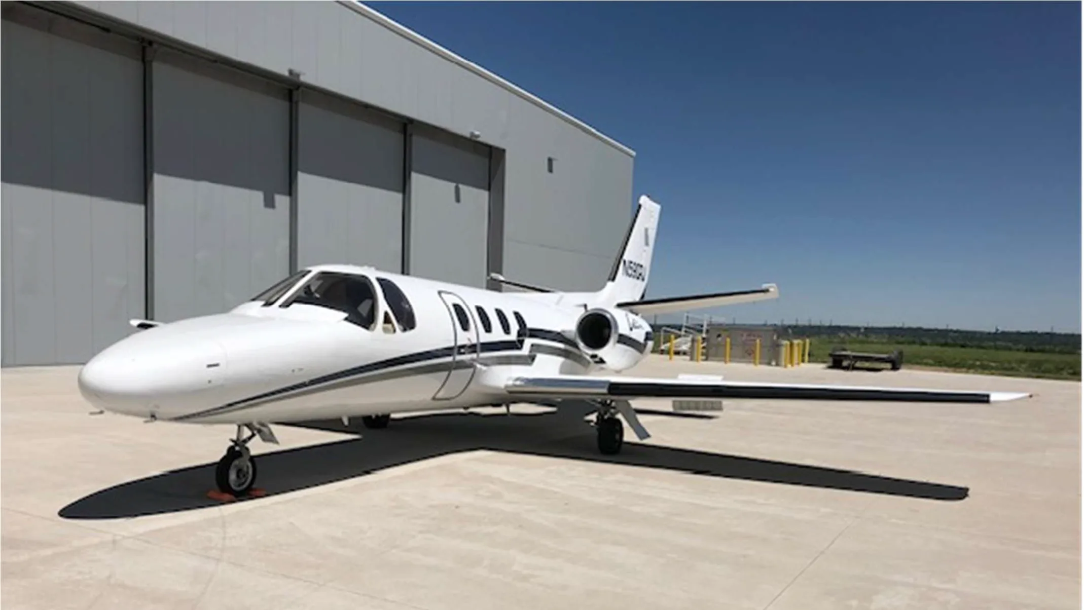 Cessna Citation N590RJ parked on the tarmac.