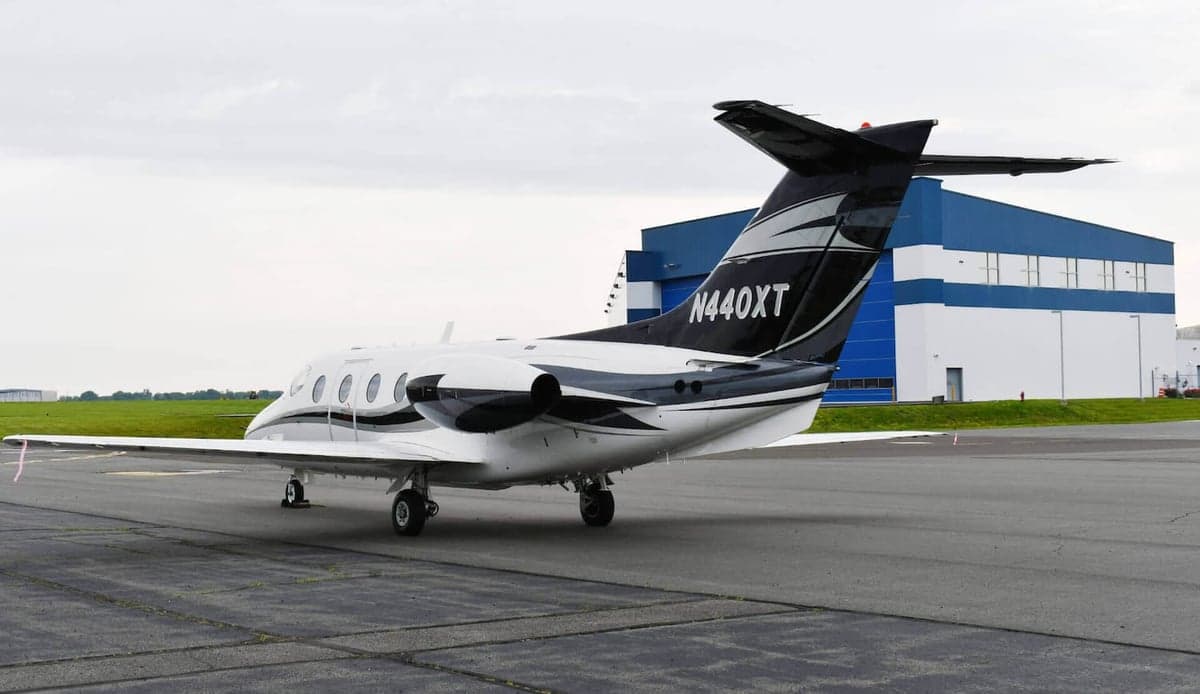 Rear quarter view of the N440XT jet on the tarmac.