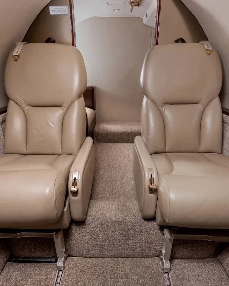 View of the aircraft interior showing two passenger seats.