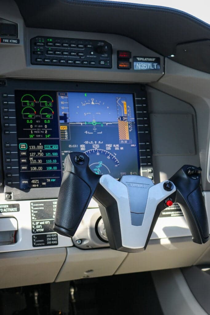Close-up of the Pilatus PC-24 cockpit instrument panel and control yoke.