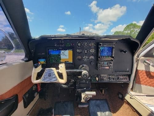The cockpit features a modern instrument panel with multiple displays.