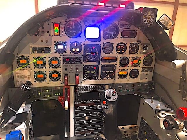 View of the aircraft's instrument panel with various gauges and controls.