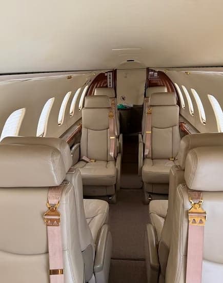 View of the Learjet's cabin with tan leather seats.